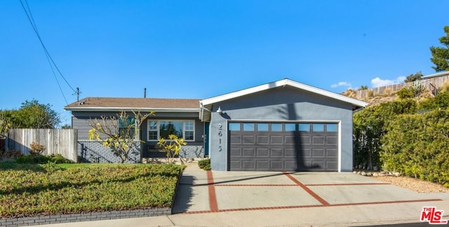 ranch-style house featuring a garage