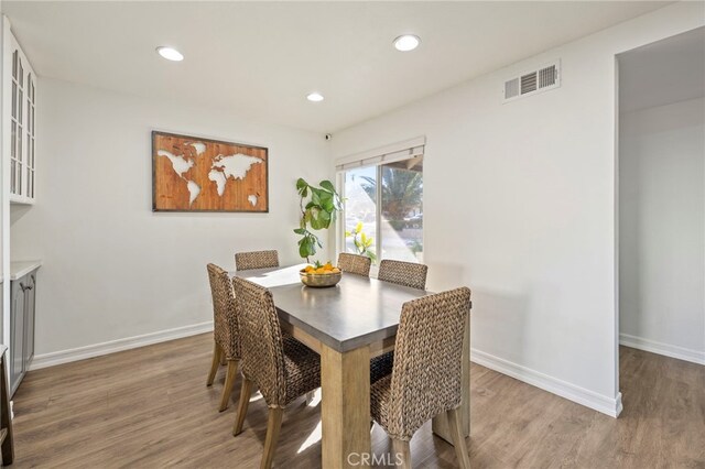 dining room with wood-type flooring