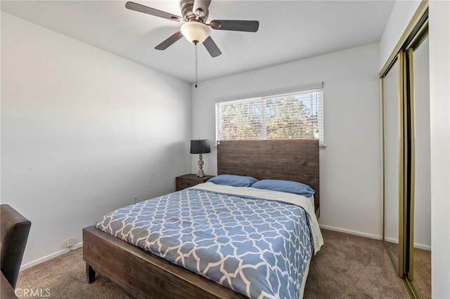 carpeted bedroom with ceiling fan and a closet