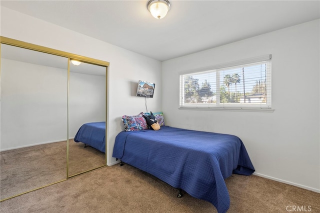 bedroom with a closet and carpet