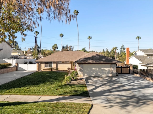 ranch-style house featuring a garage and a front lawn