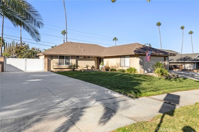 ranch-style home with a front lawn