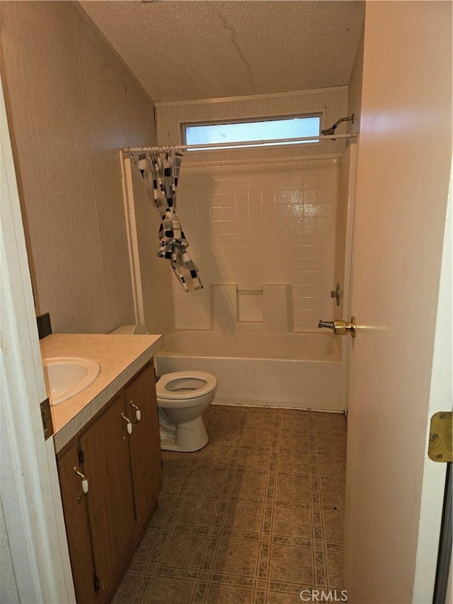 full bathroom featuring vanity, toilet, a textured ceiling, and bathtub / shower combination