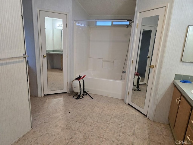 bathroom with vanity and shower / bath combination