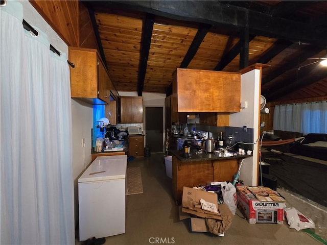 kitchen with vaulted ceiling with beams and wood ceiling