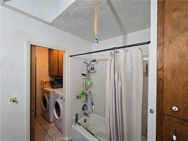 bathroom featuring washer and clothes dryer, shower / bath combo with shower curtain, tile patterned floors, and a textured ceiling