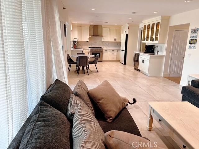 tiled living room featuring sink