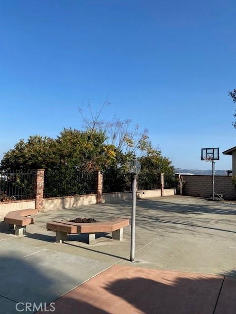 view of property's community featuring fence