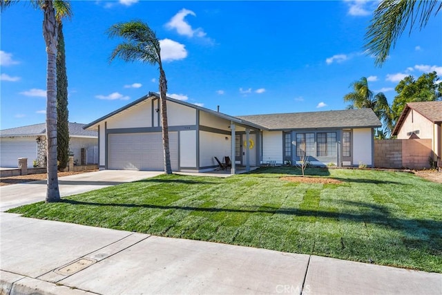 ranch-style home featuring a front yard and a garage