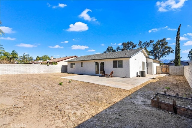 back of house featuring a patio and central air condition unit