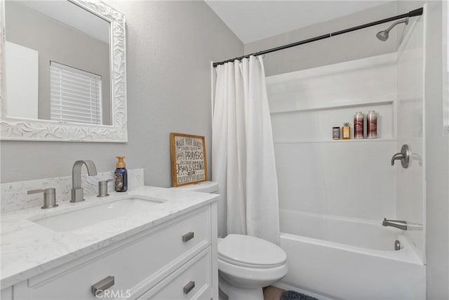 full bathroom with shower / bath combination with curtain, vanity, and toilet