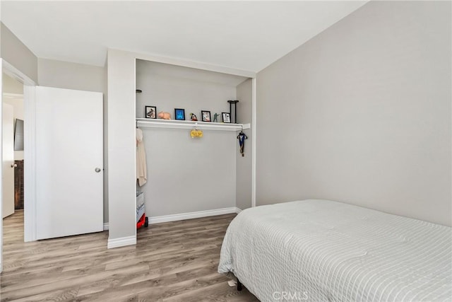 bedroom with light hardwood / wood-style flooring