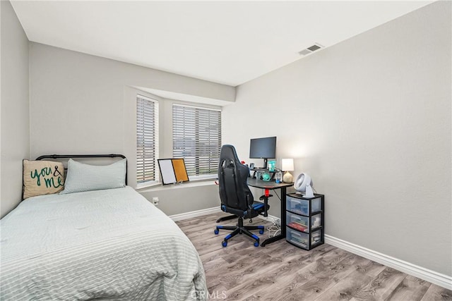 bedroom featuring wood-type flooring