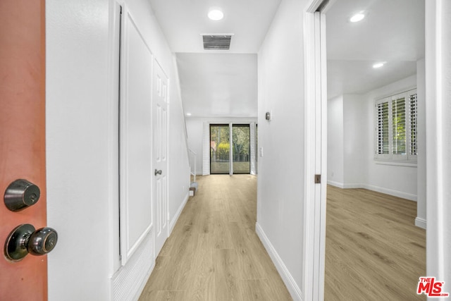 corridor featuring light hardwood / wood-style flooring