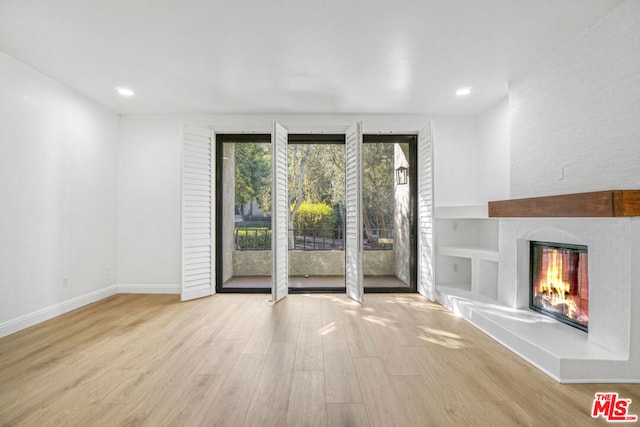 unfurnished living room with light hardwood / wood-style floors