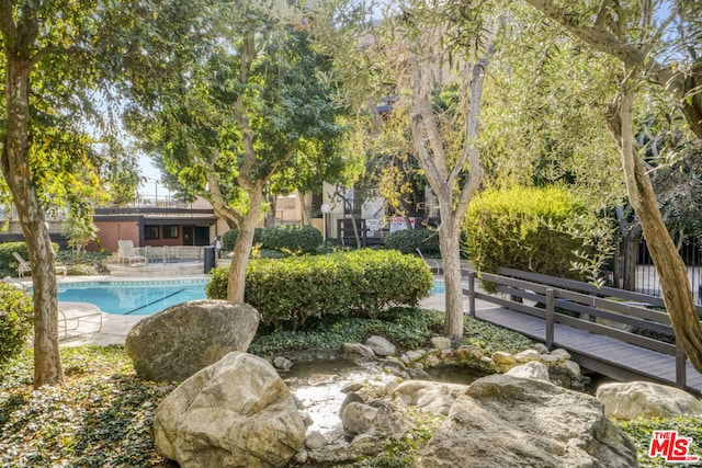 view of property's community featuring a pool