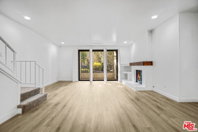 unfurnished living room featuring light hardwood / wood-style flooring