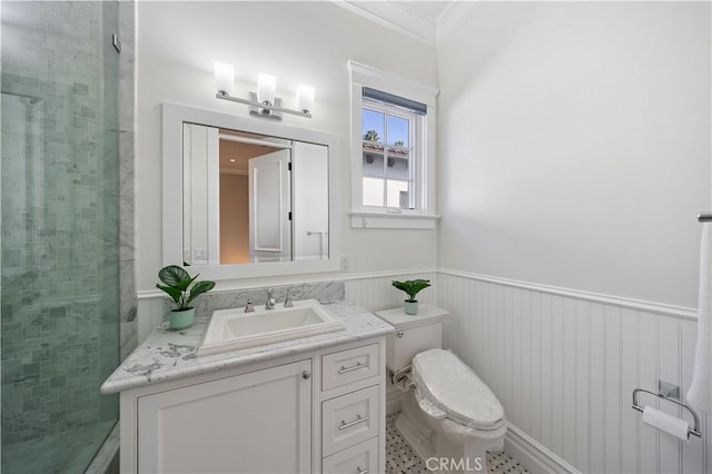 bathroom featuring ornamental molding, vanity, toilet, and a shower with shower door