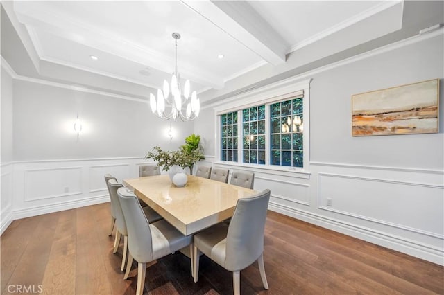 dining room with beam ceiling, a notable chandelier, crown molding, and hardwood / wood-style floors