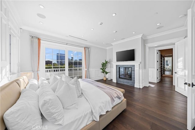 bedroom featuring crown molding and dark wood-type flooring