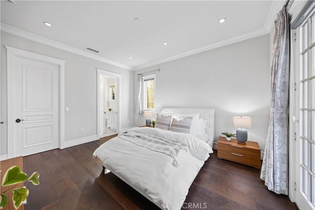 bedroom featuring ensuite bathroom, dark hardwood / wood-style floors, and ornamental molding