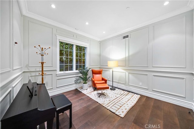 living area featuring dark hardwood / wood-style floors and crown molding