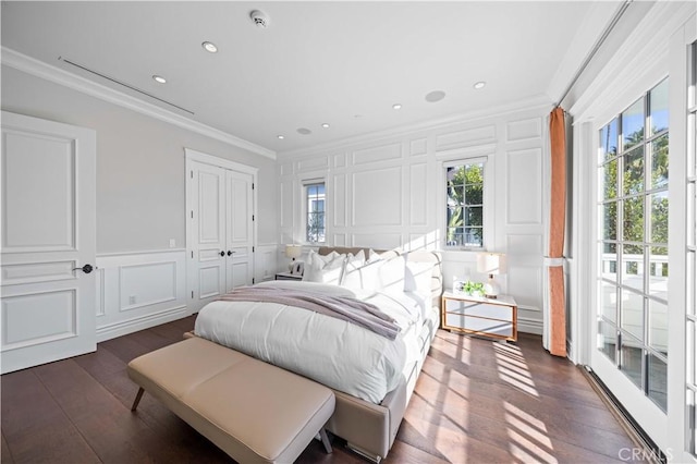 bedroom featuring dark hardwood / wood-style floors and ornamental molding