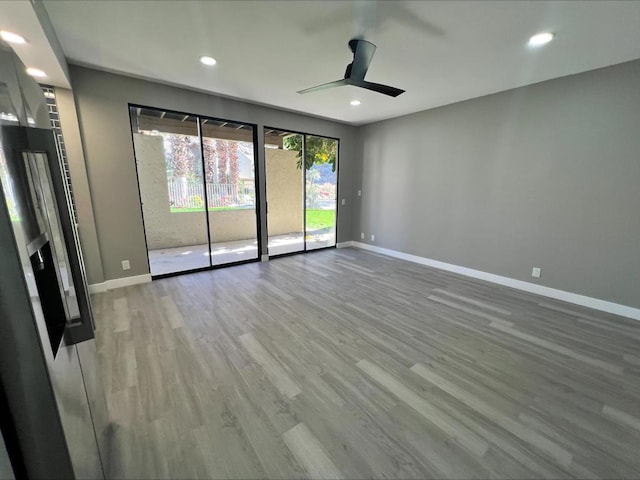 spare room featuring ceiling fan and wood-type flooring