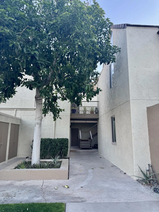 view of property exterior featuring a balcony