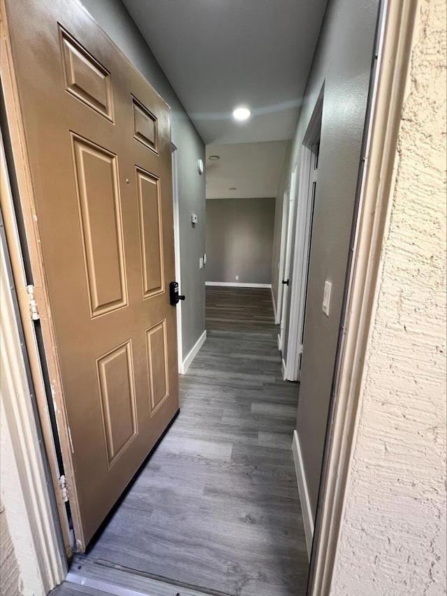 hallway featuring dark hardwood / wood-style floors