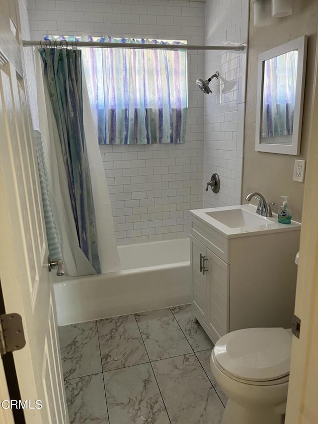 full bathroom with shower / bath combo, vanity, and toilet