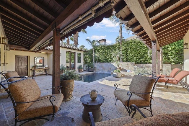 view of patio / terrace with a fenced in pool