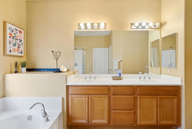 bathroom with vanity and independent shower and bath