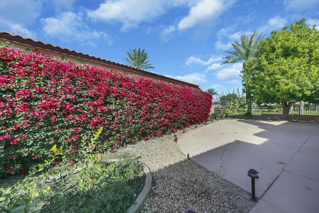 view of side of property with a patio area