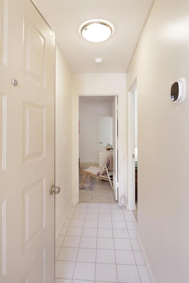 hallway with light tile patterned flooring