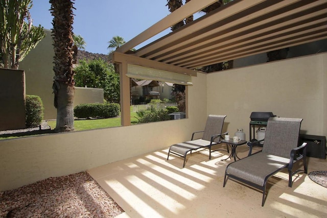 view of patio with a pergola and grilling area