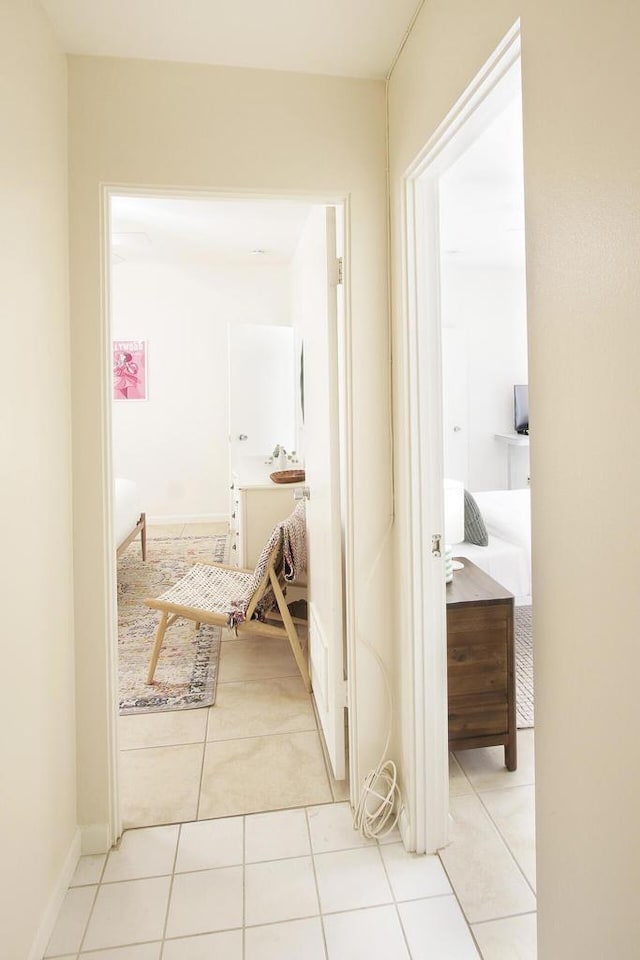 hallway with light tile patterned floors