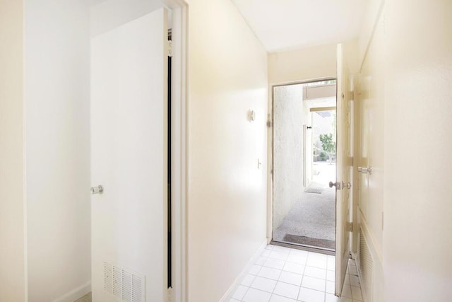 hallway with light tile patterned floors