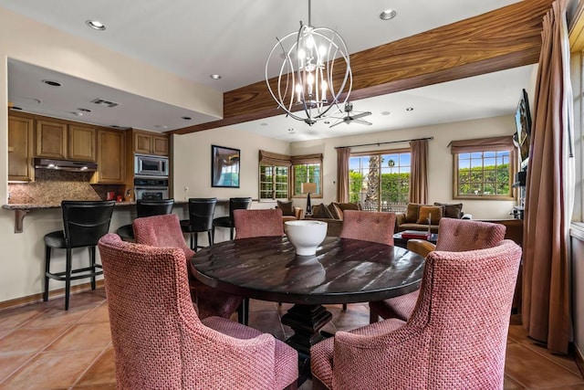 tiled dining space with a notable chandelier