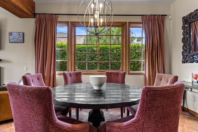 tiled dining area featuring an inviting chandelier