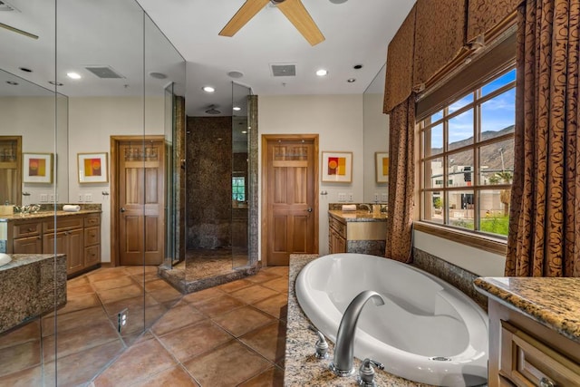 bathroom with tile patterned flooring, shower with separate bathtub, vanity, and ceiling fan