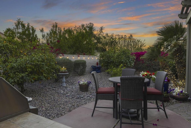 view of patio terrace at dusk