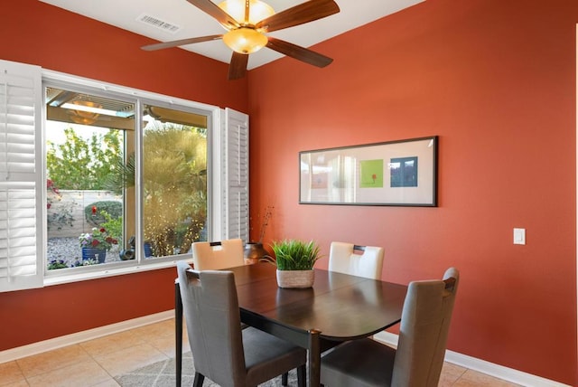 dining area with ceiling fan and light tile patterned floors