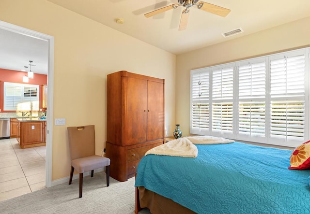 tiled bedroom featuring sink and ceiling fan