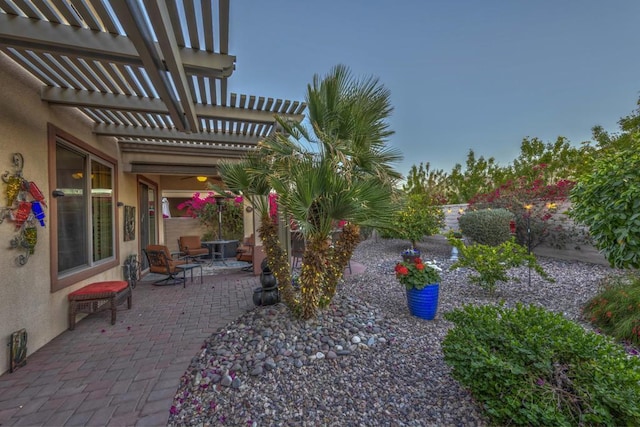 view of yard with a pergola and a patio area