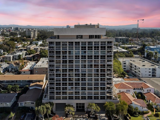 view of outdoor building at dusk