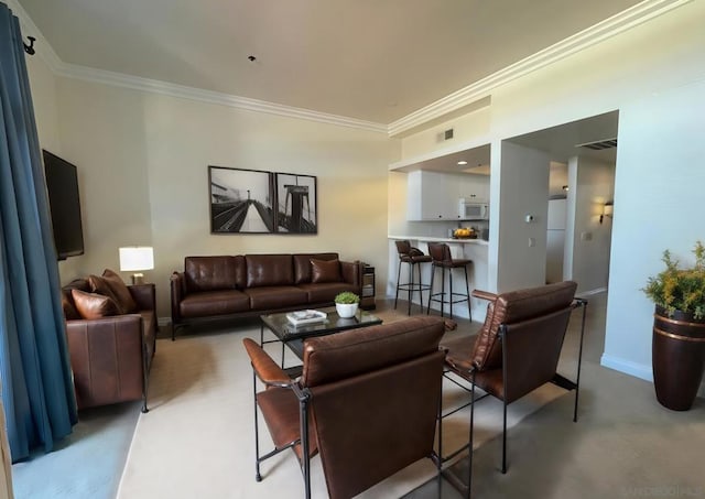 living room with ornamental molding