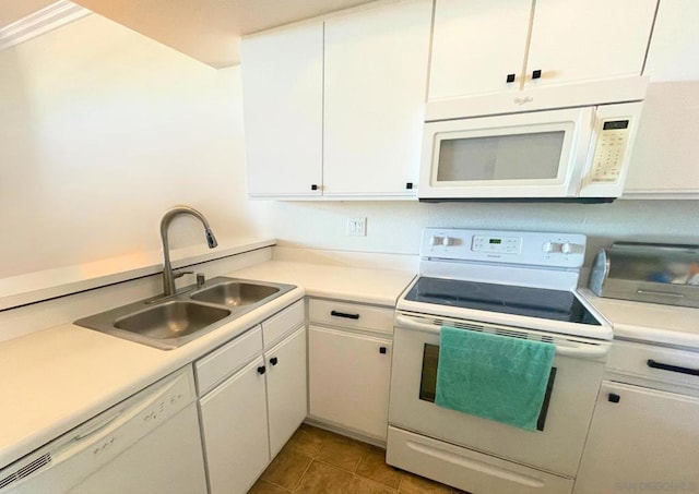 kitchen featuring white cabinets, white appliances, sink, and light tile patterned floors