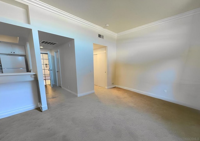 empty room featuring ornamental molding