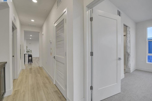 hallway with light wood-type flooring